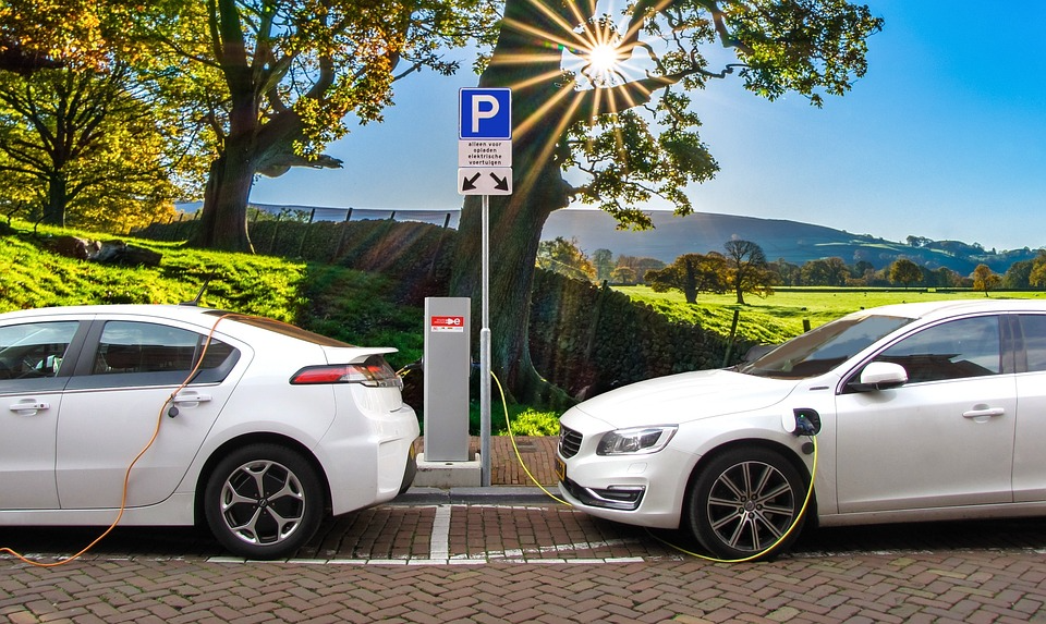 Image showing 2 cars are getting charged as a symbol of green technologies
