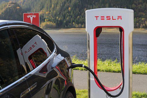 Tesla electric car at charging station.